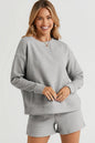 Trendsi double take chestnut long sleeve textured top with matching drawstring shorts set, casual and comfortable fashion ensemble.