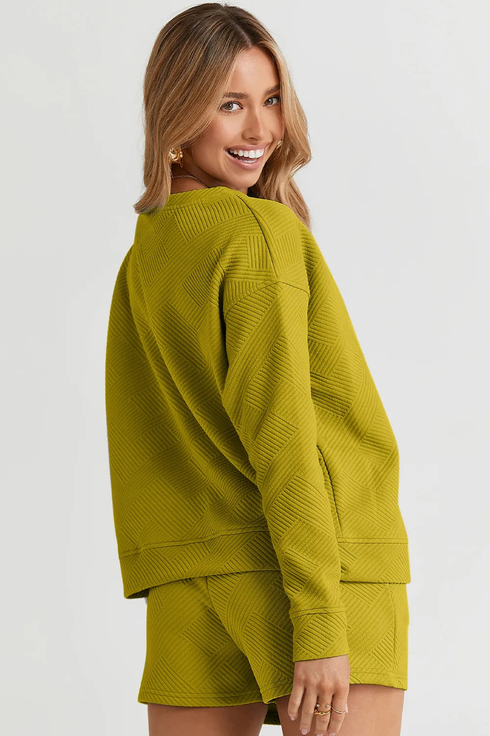 Trendsi chestnut-colored long sleeve textured top with matching drawstring shorts set, casual and comfortable for everyday wear.
