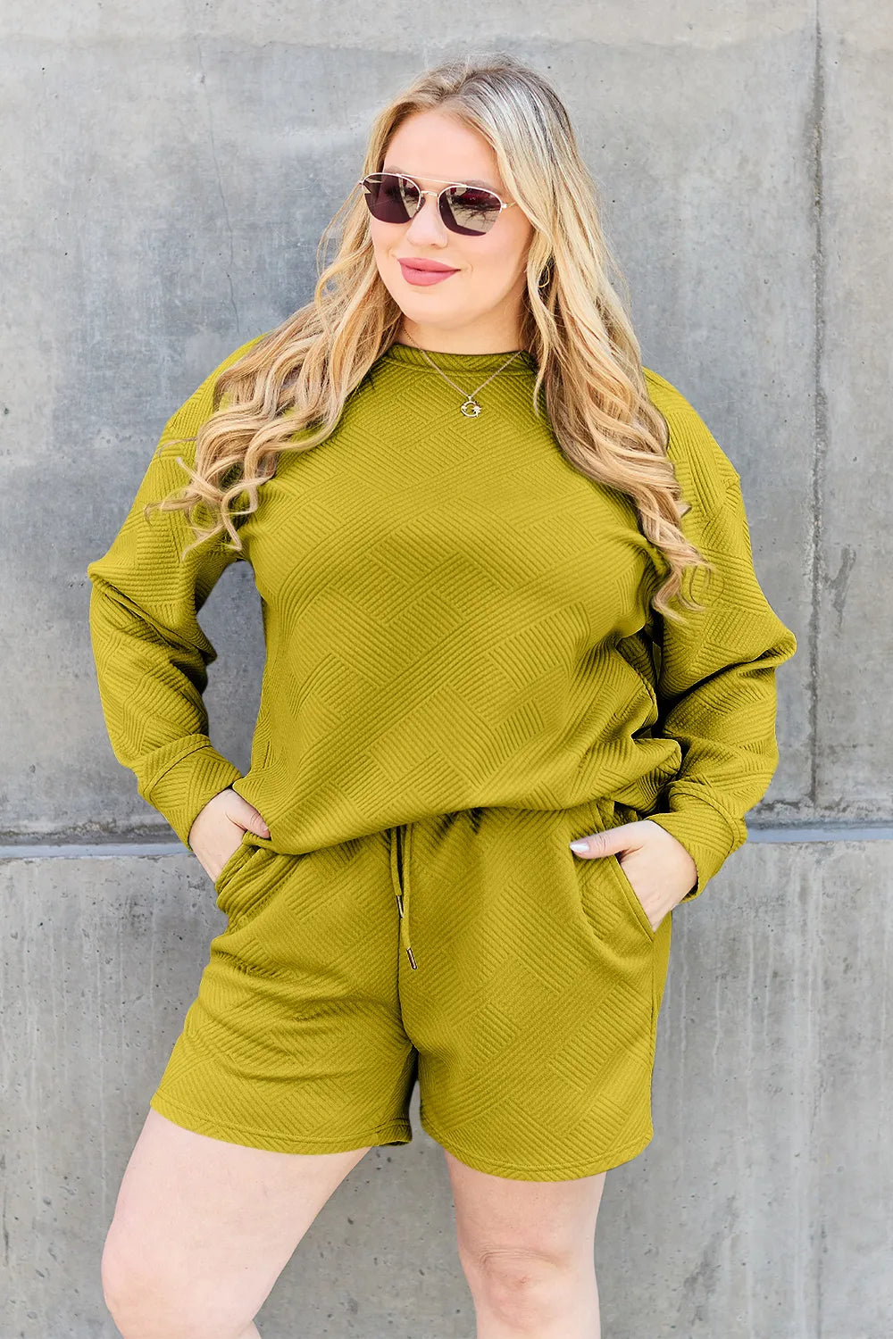 Trendsi Double Take chestnut long sleeve textured top with matching drawstring shorts set, casual and comfortable for everyday wear.