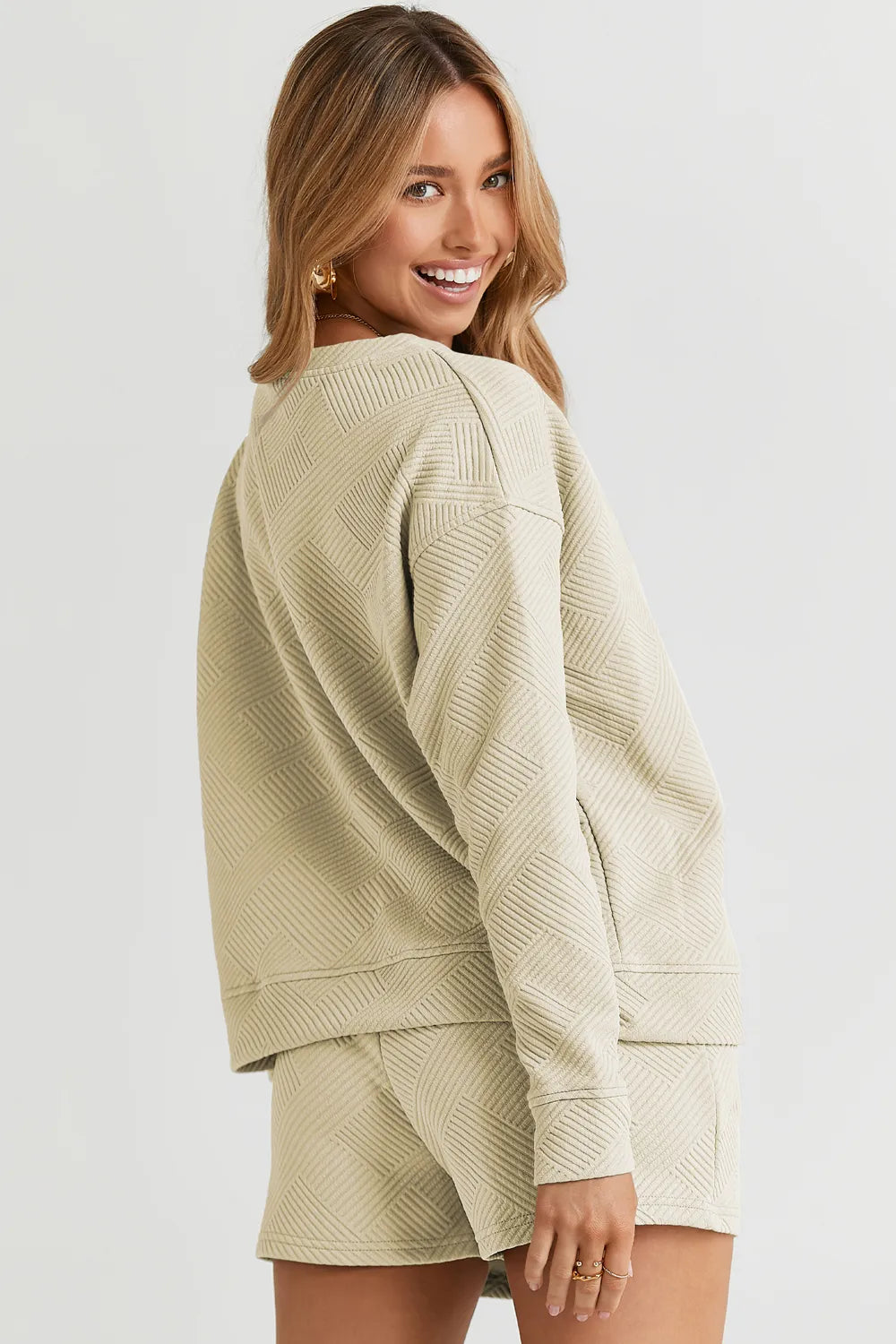 Trendsi chestnut double take full-size textured long sleeve top with matching drawstring shorts set on a model.