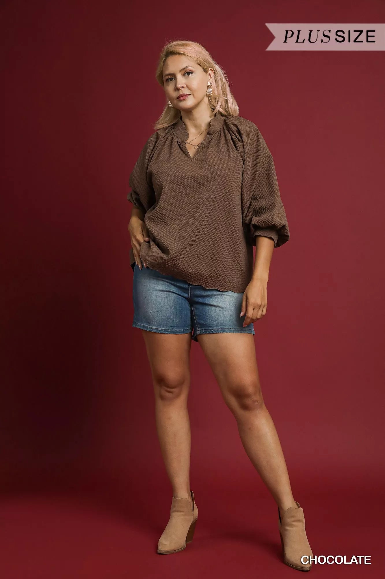 Plus size Umgee textured balloon sleeve blouse with notched details, in chocolate color, featuring full-length sleeves.