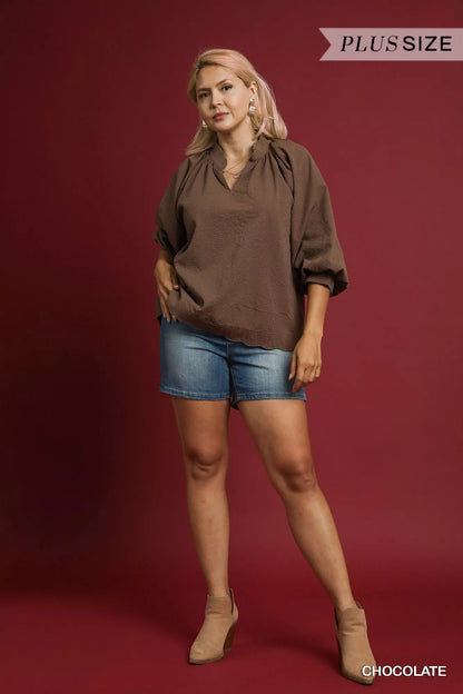 Plus size Umgee textured balloon sleeve blouse with notched details, in chocolate color, featuring full-length sleeves.