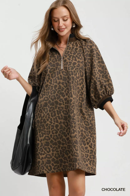 Chocolate leopard print mini dress by Umgee featuring a quarter zip and puff sleeves, perfect for casual or stylish wear.