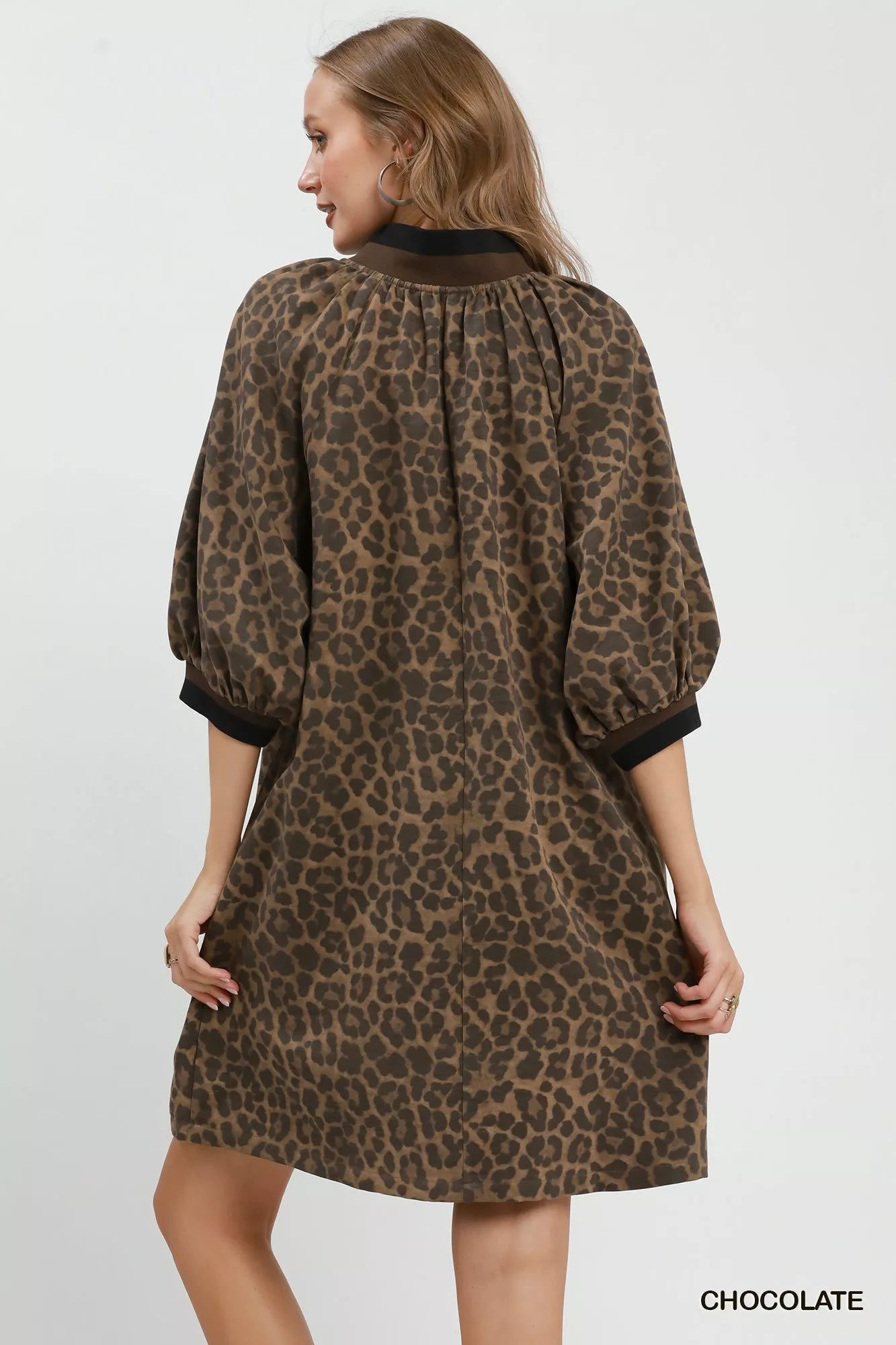 Umgee leopard print quarter zip puff sleeve mini dress, trendy fashion piece with stylish print and comfortable fit.