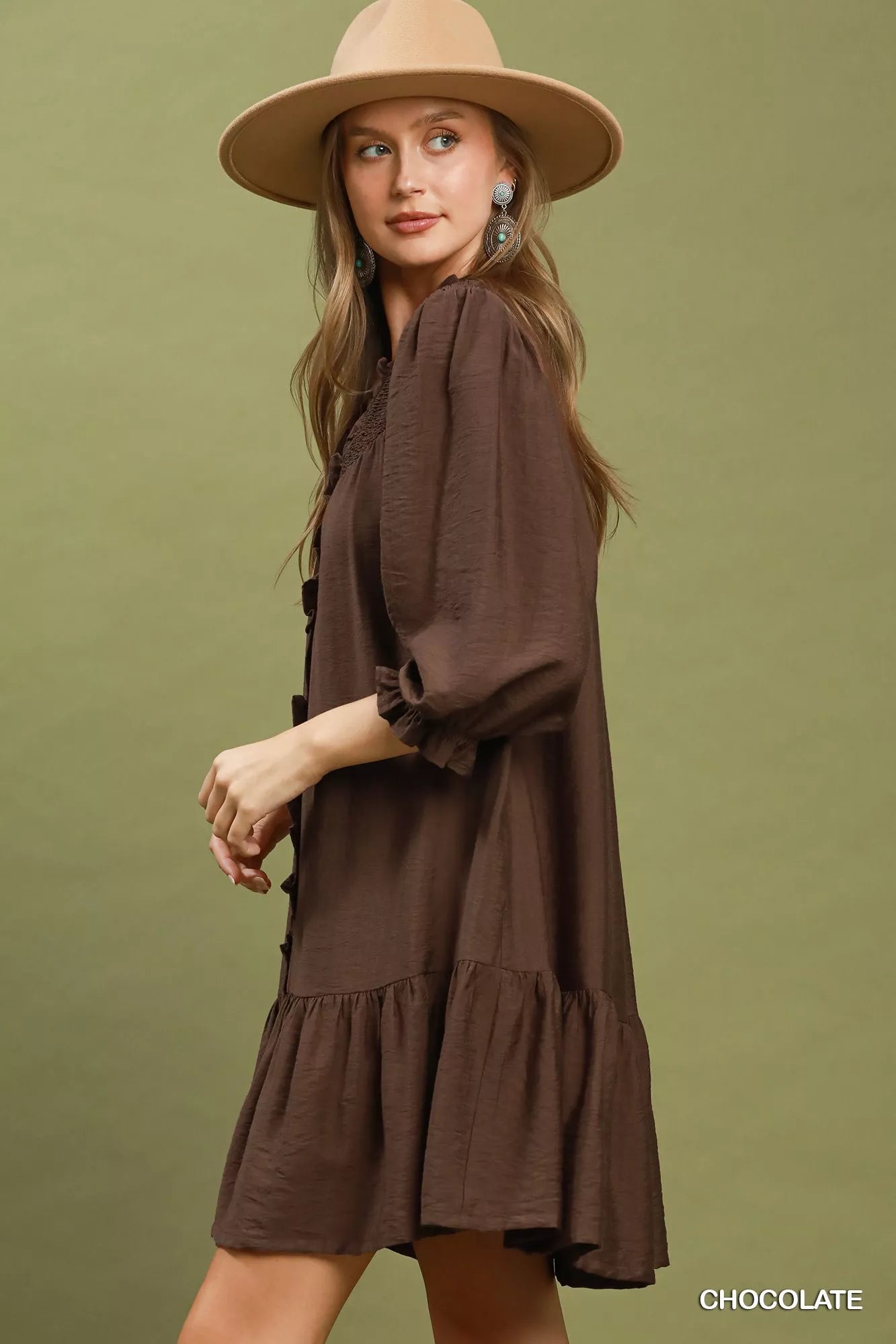 Chocolate brown Umgee smocked ruffle tiered mini dress with feminine details, perfect for casual or semi-formal occasions.