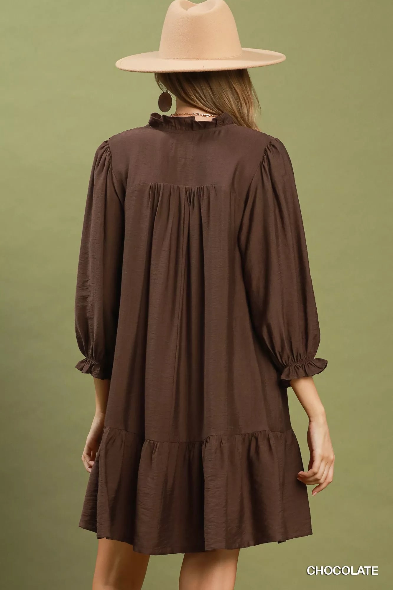 Chocolate brown Umgee mini dress with smocked bodice, ruffle details, and tiered skirt, perfect for casual or dressy occasions.