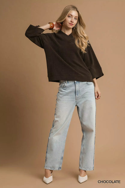 Chocolate brown Umgee textured knit V-neck top from Trendsi, featuring a cozy, stylish design with a fitted silhouette.