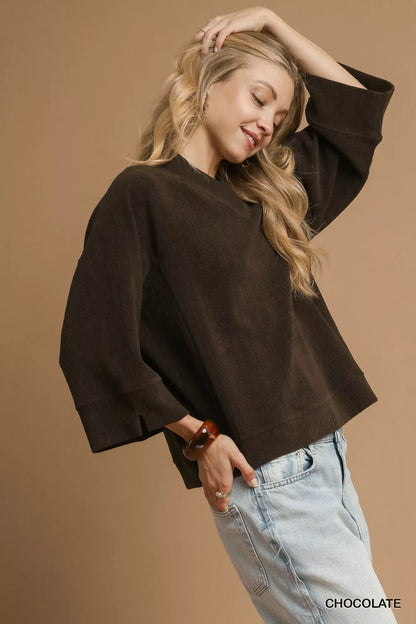 Chocolate brown Umgee textured knit V-neck top from Trendsi, featuring a cozy, stylish V-neck design and soft knit fabric.