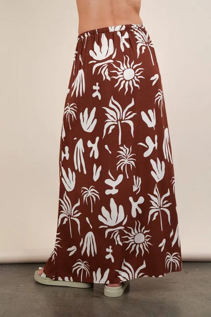 Chocolate-colored Very J printed resort midi skirt by Trendsi, featuring a flowy design and vibrant pattern.