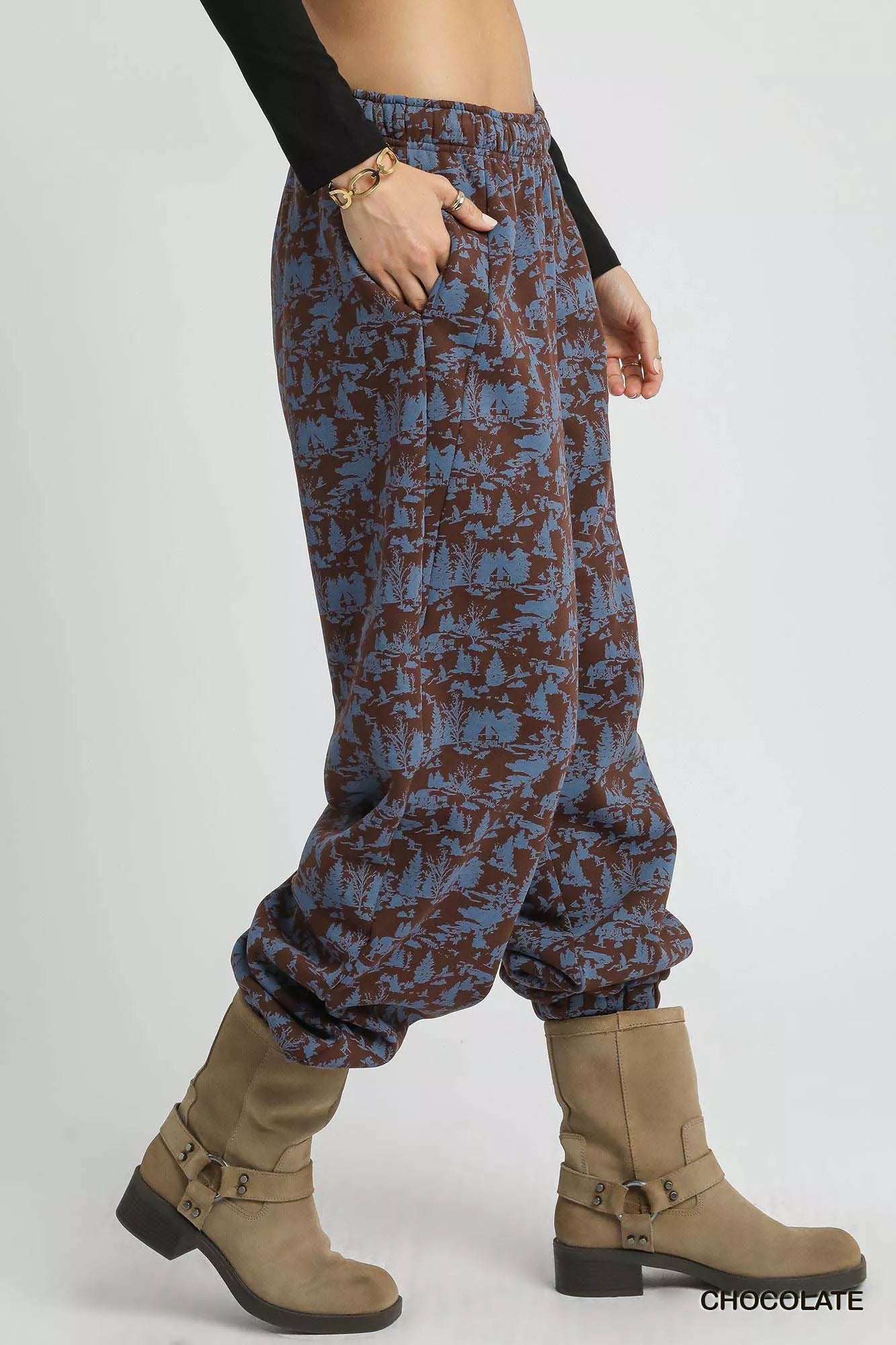Chocolate-colored Umgee Scenic Print casual sweatpants with a relaxed fit, featuring a scenic pattern and elastic waistband.
