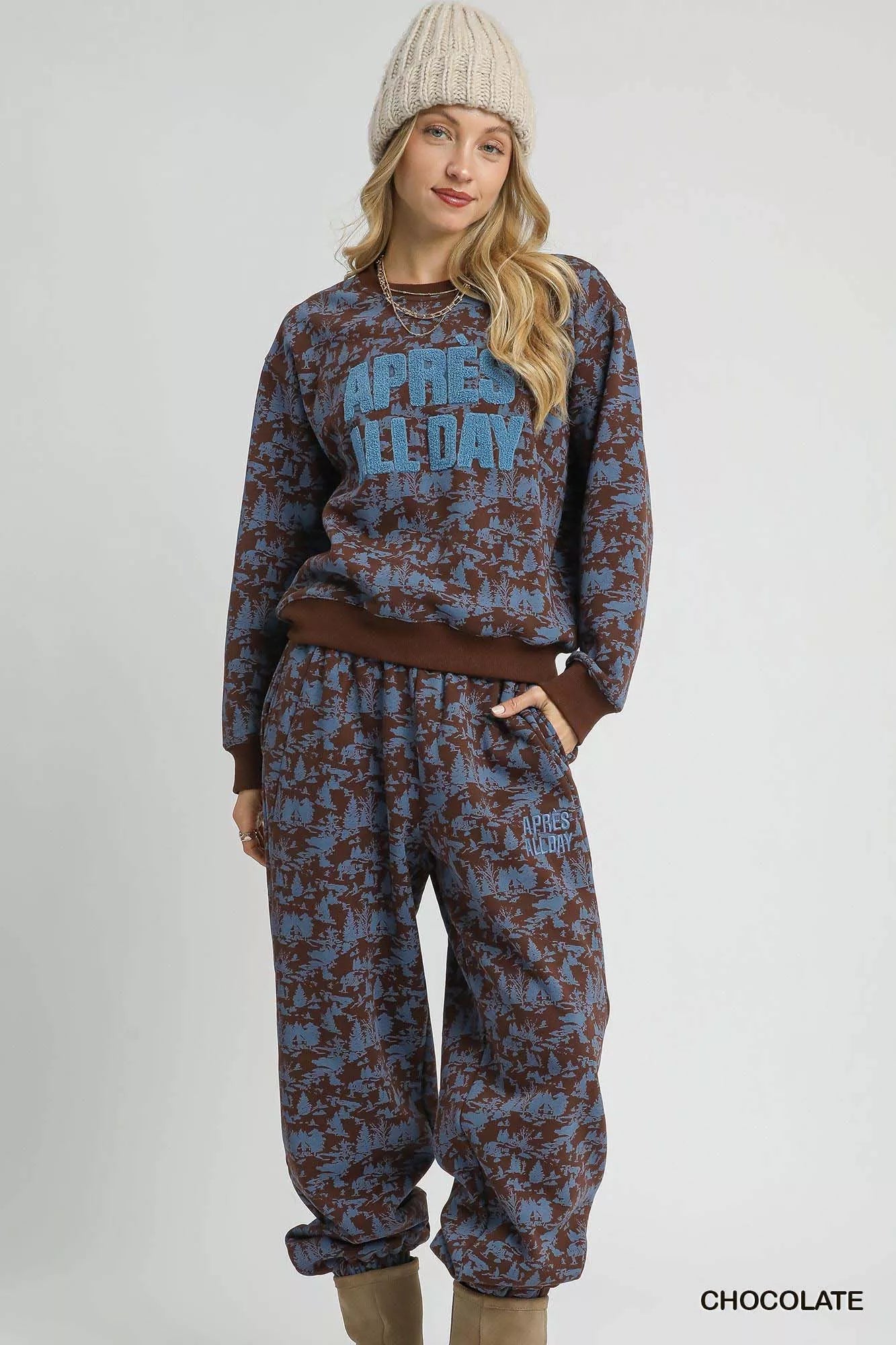 Chocolate-colored Umgee Scenic Print casual sweatpants with a relaxed fit and scenic pattern, designed for comfy everyday wear.