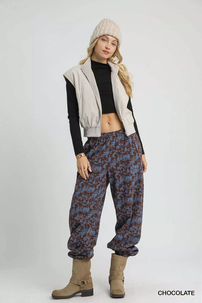 Chocolate casual sweatpants with scenic print from Umgee, styled for a comfortable, relaxed look.