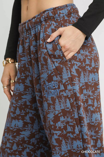 Chocolate casual sweatpants by Umgee with scenic print, relaxed fit, and elastic waistband for comfortable everyday wear.