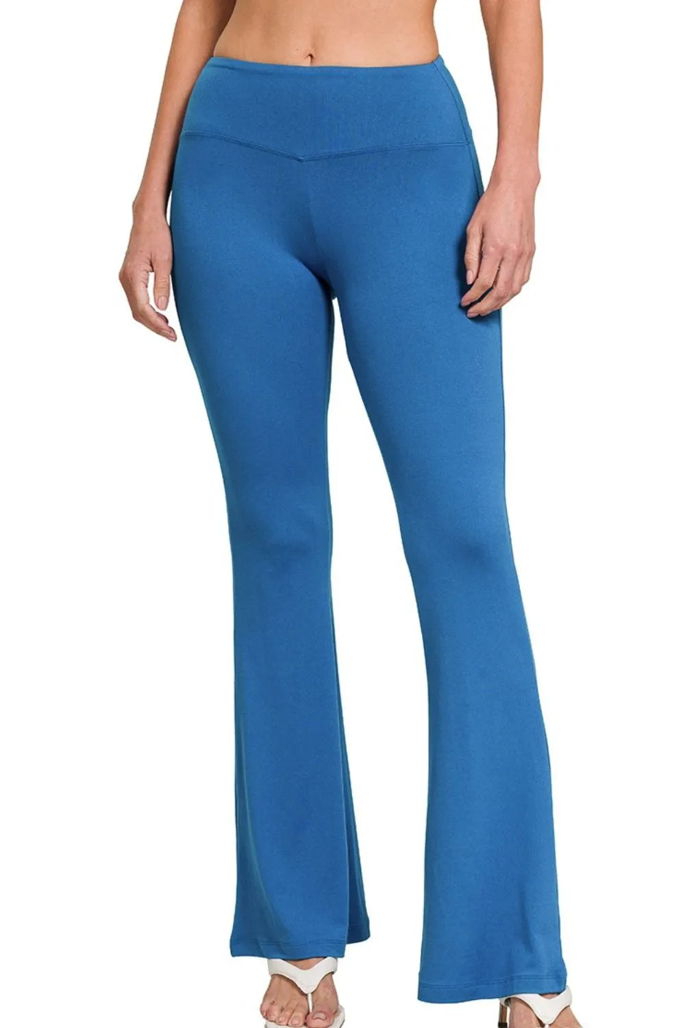 Zenana buttery soft flare leg high waist yoga pants in classic blue, made by Trendsi, shown on a model.
