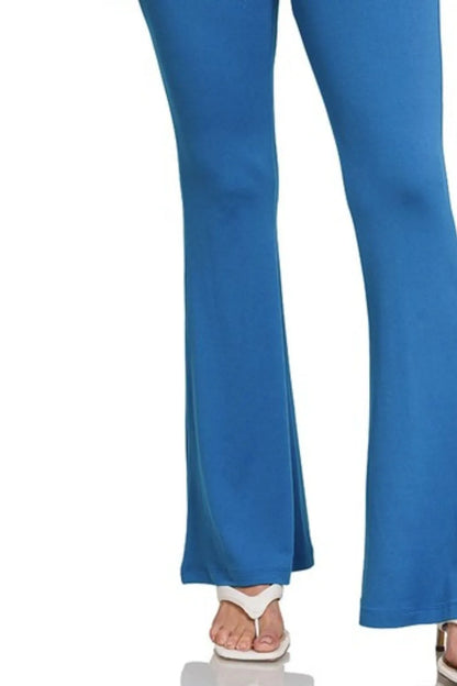 Zenana buttery soft flare leg high waist yoga pants in classic blue, made by Trendsi, shown on a model.
