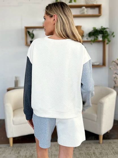 Cloudy blue double take full-size contrast drop shoulder top and shorts set by Trendsi, casual and stylish for warm weather.