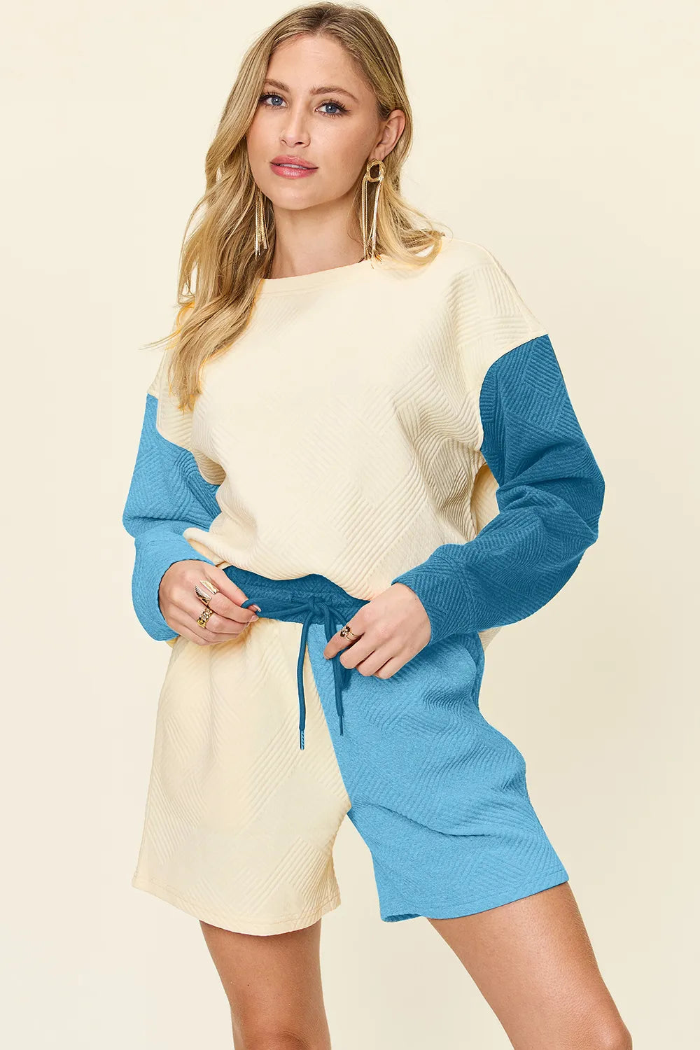 Cloudy blue double take full-size contrast drop shoulder top and shorts set by Trendsi, casual and stylish women's outfit.