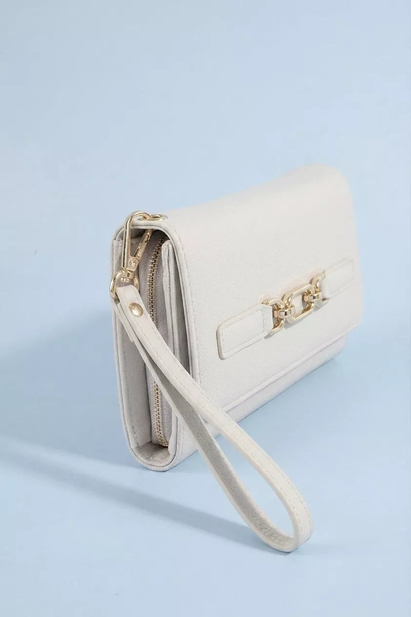 Vegan leather wristlet wallet by Trendsi featuring a chain buckle and compact design for easy carrying and style.