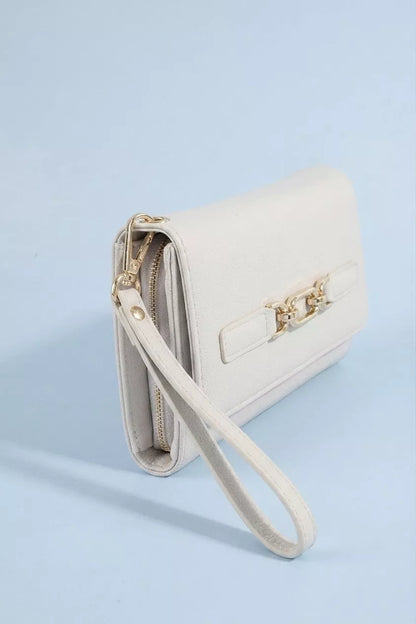 Vegan leather wristlet wallet by Trendsi featuring a chain buckle and compact design for easy carrying and style.