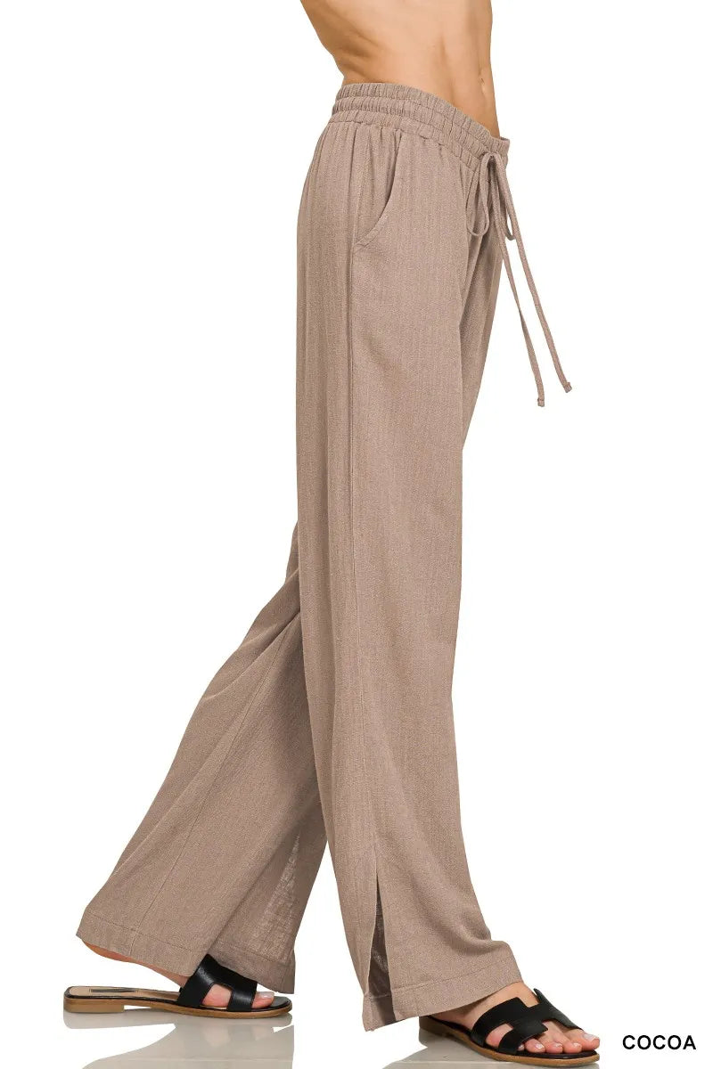Cocoa Zenana linen drawstring pants by Trendsi featuring a relaxed fit and lightweight fabric, shown on a model.
