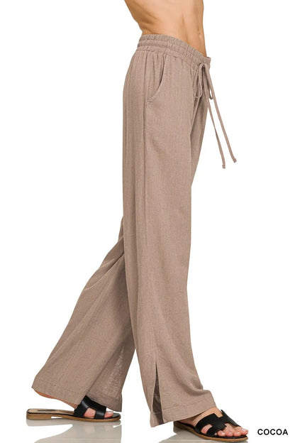 Cocoa Zenana linen drawstring pants by Trendsi featuring a relaxed fit and lightweight fabric, shown on a model.