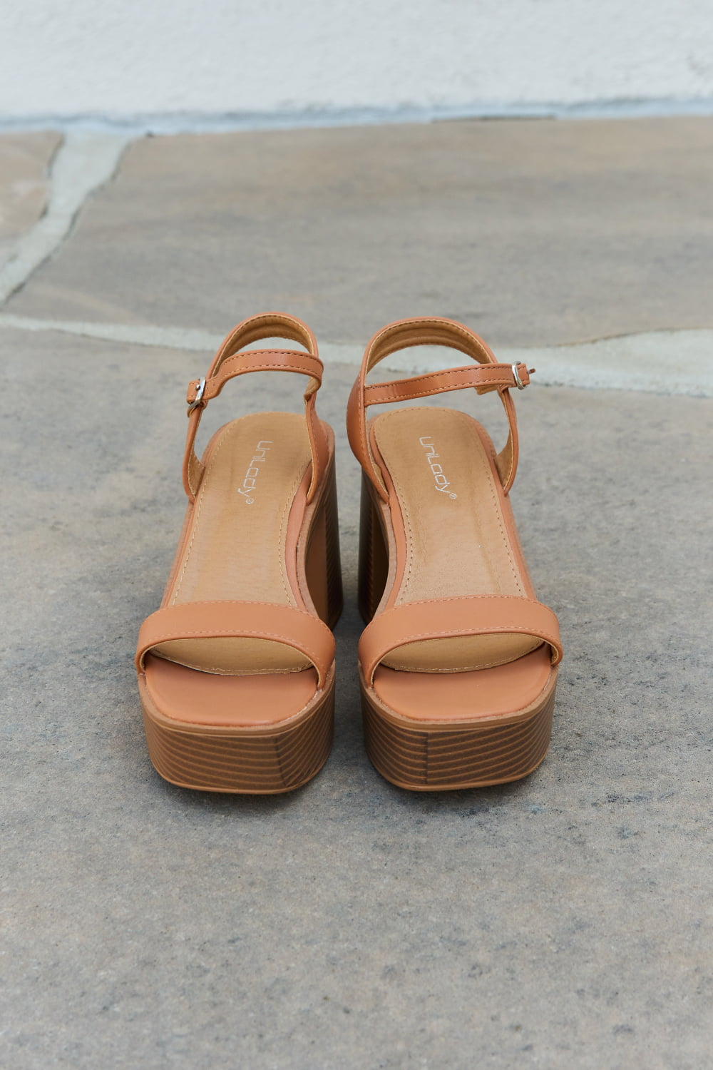 Cognac Weeboo Feel It platform heel sandals by Trendsi, featuring open toes and chunky heels, stylish for casual or dressy wear.