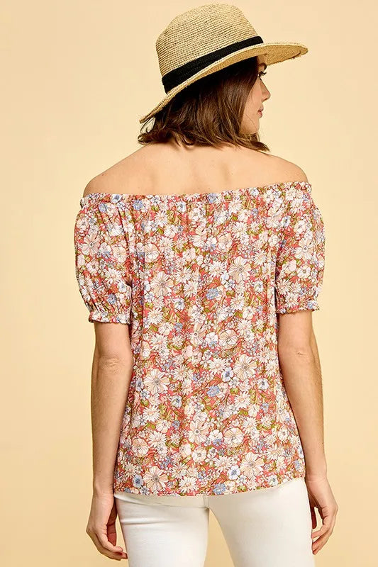 Lime 'N' Chili floral print short sleeve off-the-shoulder blouse by Trendsi, featuring vibrant colorful floral design.
