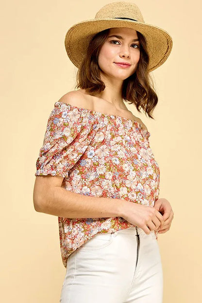 Lime 'N' Chili floral print short sleeve off-the-shoulder blouse by Trendsi, featuring vibrant colorful floral design and relaxed fit.