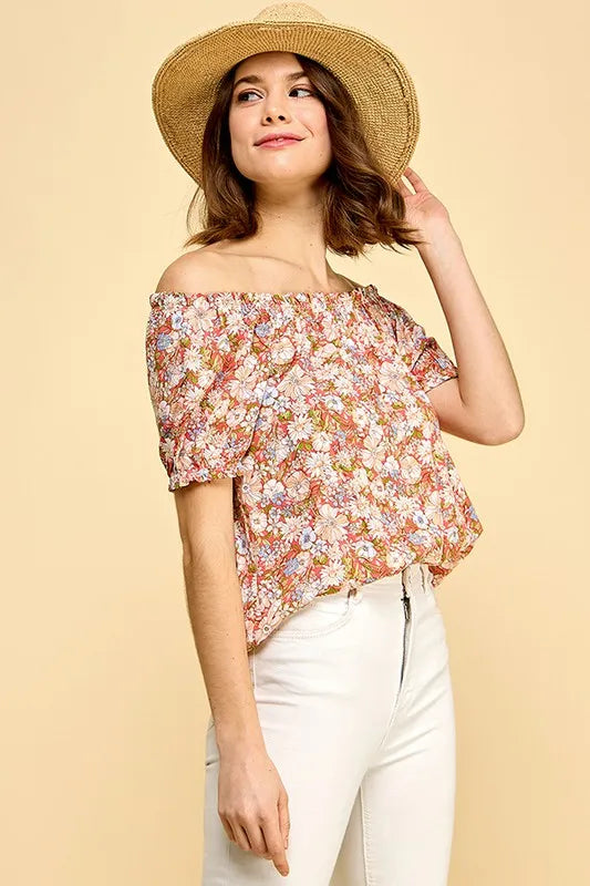 Lime 'N' Chili floral print short sleeve off-the-shoulder blouse by Trendsi, featuring vibrant colors and lightweight fabric.