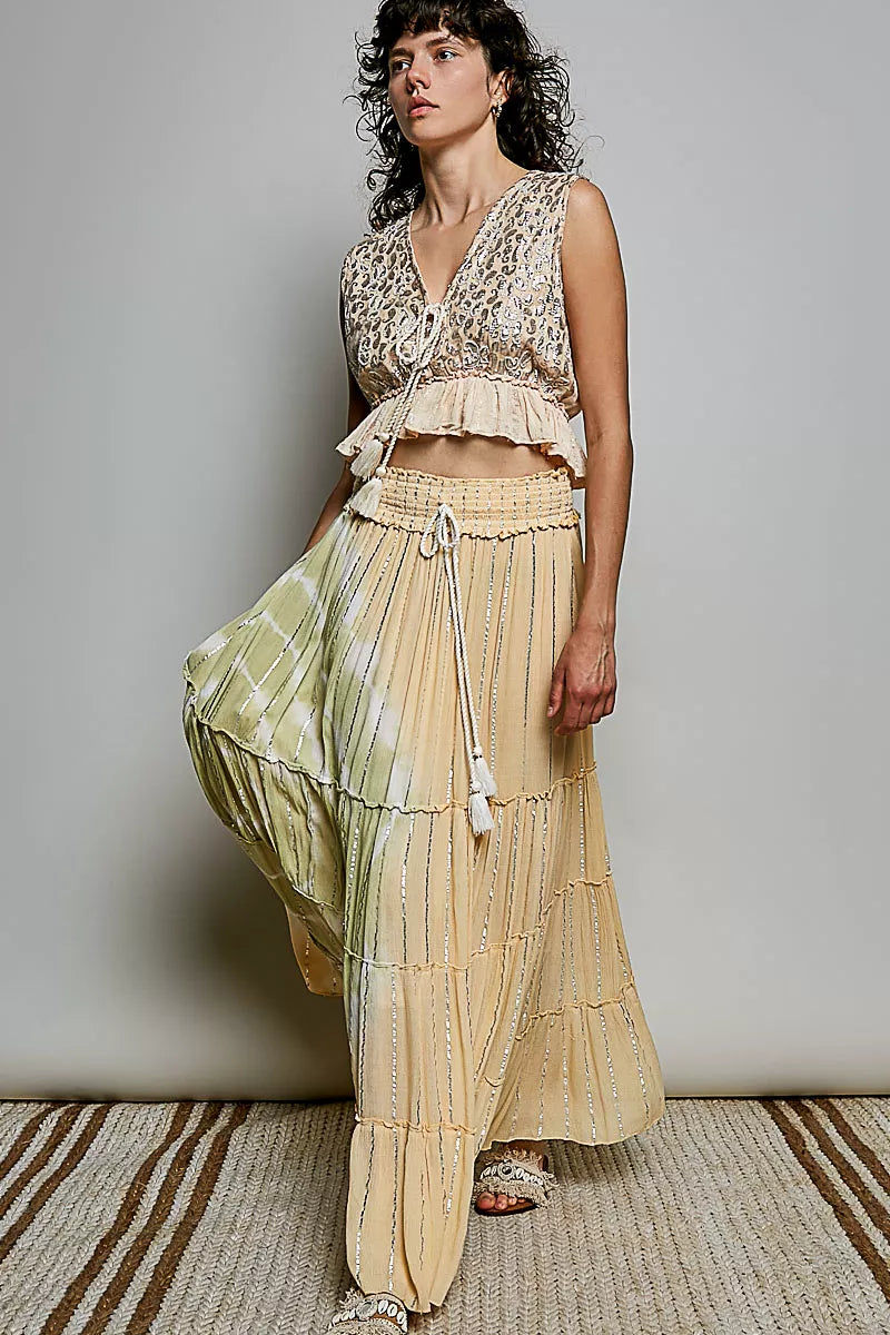 Trendsi coral haze multi shimmer pattern sleeveless crop top with deep V neckline, tie front, tassel details, and ruffle hem.