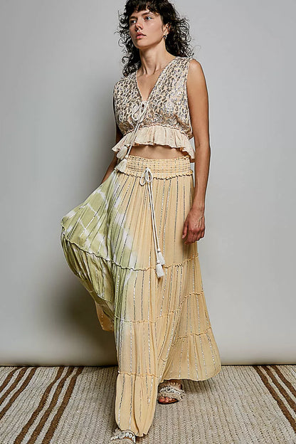 Trendsi coral haze multi shimmer pattern sleeveless crop top with deep V neckline, tie front, tassel details, and ruffle hem.