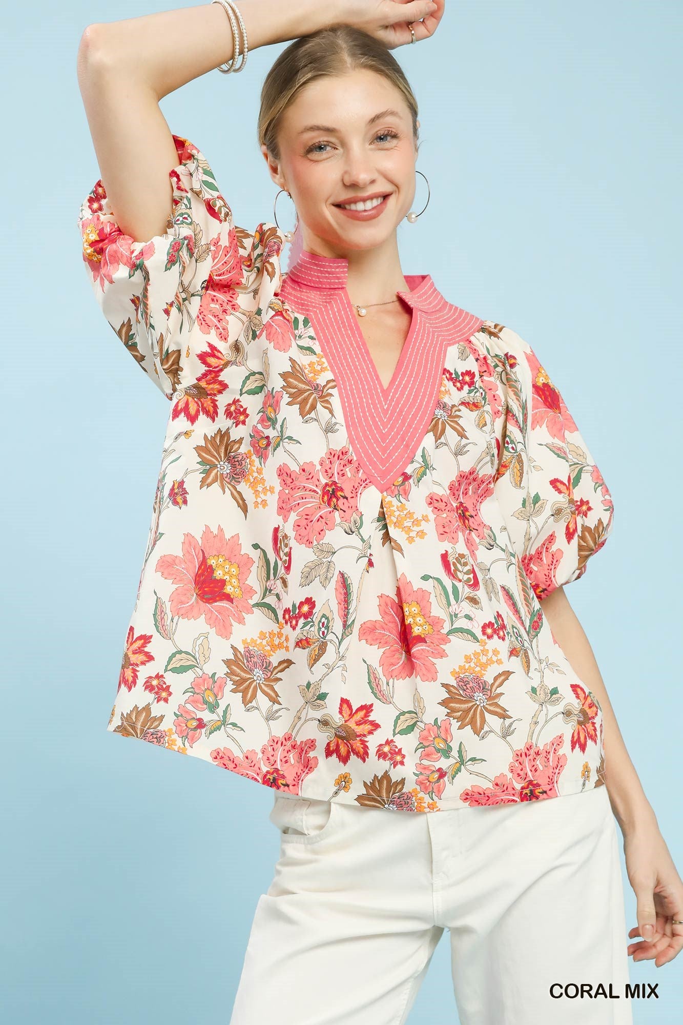 Coral mix floral puff sleeve blouse by Umgee, featuring lightweight fabric and feminine design, perfect for casual or dressy wear.