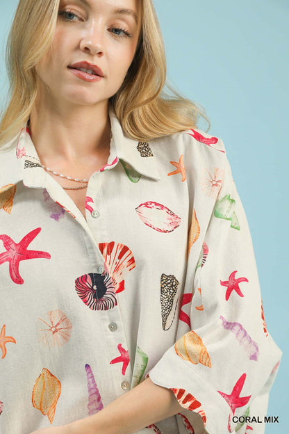 Umgee seashell and starfish print button-down top in coral mix, featuring a casual, ocean-inspired design with long sleeves.