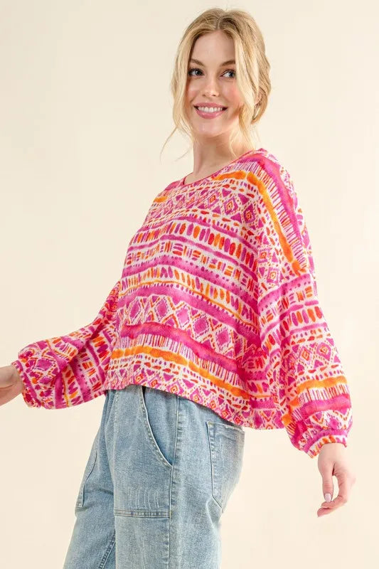Coral textured printed casual top by Trendsi featuring a cozy, relaxed fit with stylish pattern and comfortable fabric.