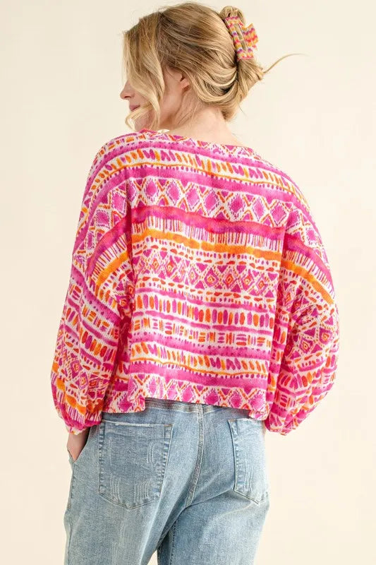 Coral textured printed casual top by Trendsi with cozy fabric and relaxed fit, featuring a stylish pattern and comfortable design.