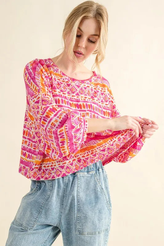 Coral textured printed casual top by Trendsi, featuring a cozy, stylish design and comfortable fit.