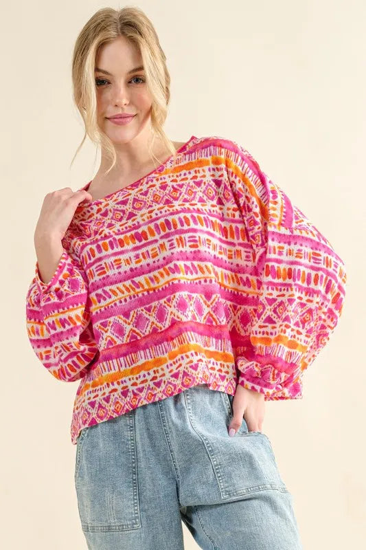 Coral textured printed casual top by Trendsi featuring a cozy, relaxed fit with stylish pattern and soft fabric.