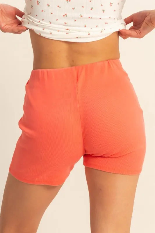 Coral high waist ribbed fitted biker shorts by HYFVE, stylish and comfortable for active or casual wear.