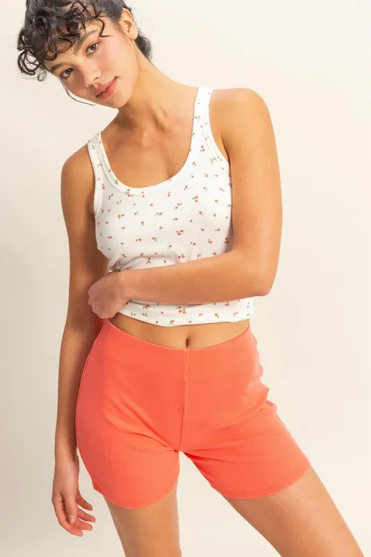 Coral high waist ribbed fitted biker shorts by HYFVE from Trendsi, showcasing a close-up of the textured, stretchy fabric.