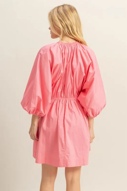 Coral HYFVE plunge balloon sleeve poplin mini dress with pockets, featuring a stylish V-neck and relaxed fit.