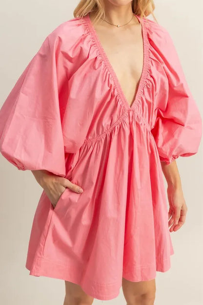 Coral HYFVE plunge balloon sleeve poplin mini dress with pockets, featuring a fitted waist and stylish design.