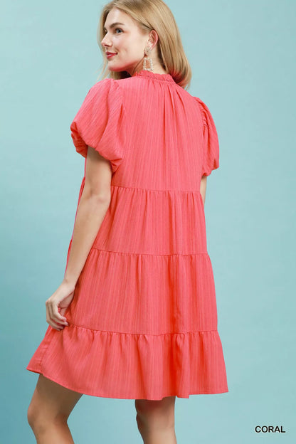 Coral Umgee puff sleeve tiered babydoll dress with ruffled sleeves and flowy silhouette, perfect for casual or dressed-up looks.
