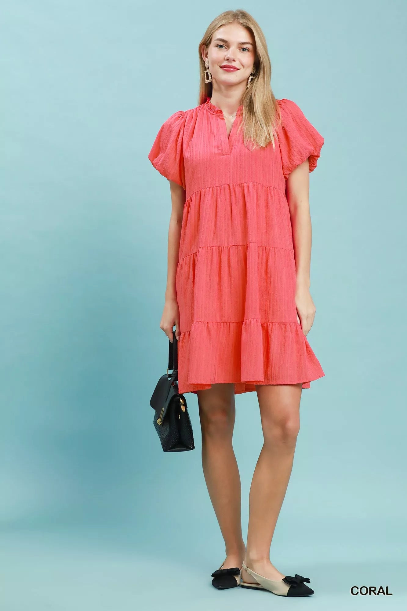 Coral Umgee puff sleeve tiered babydoll dress with ruffled sleeves and flowy silhouette, perfect for casual or summer wear.