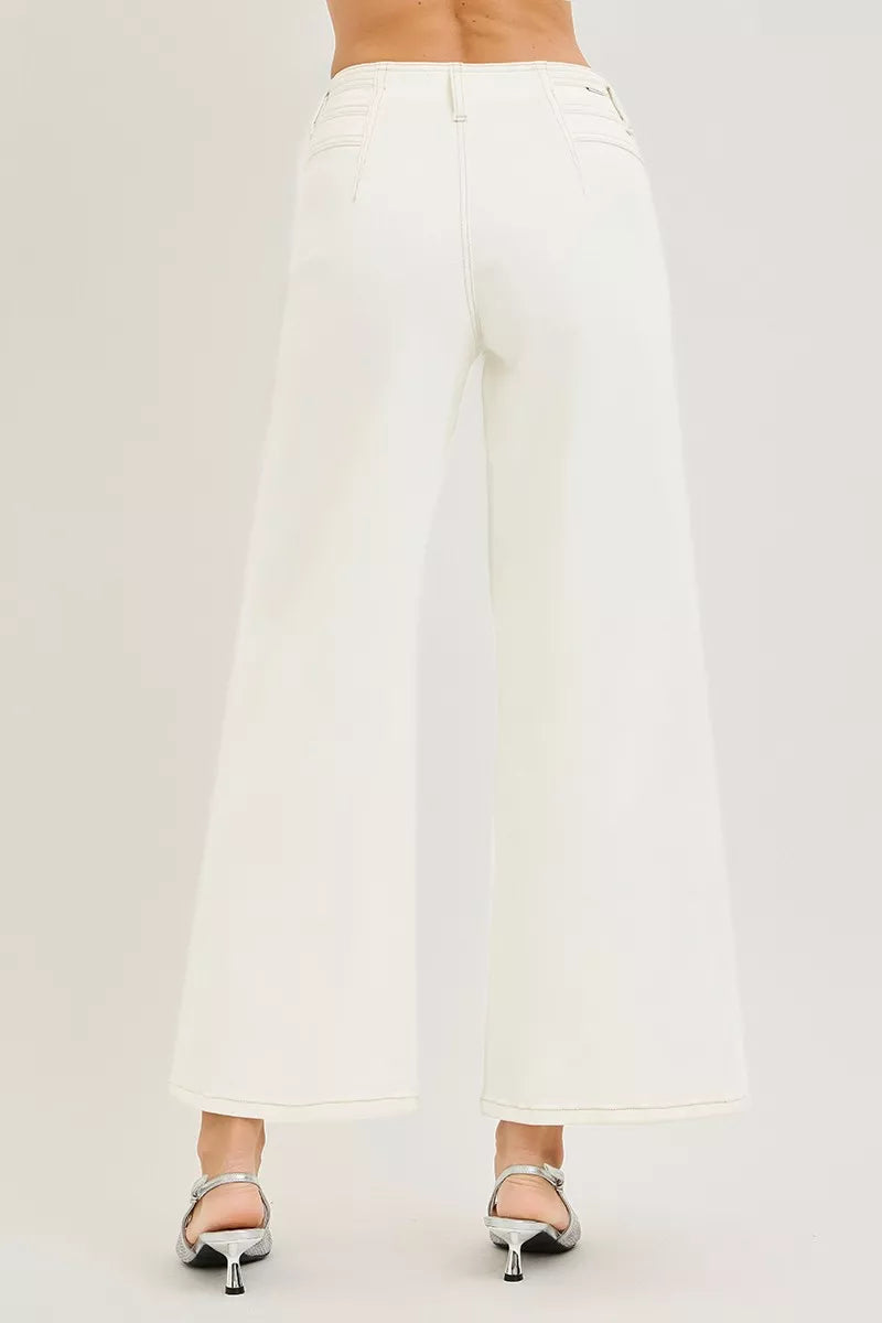 Cream RISEN high rise ankle wide pants from Trendsi displayed on a model, showing relaxed fit and stylish silhouette.