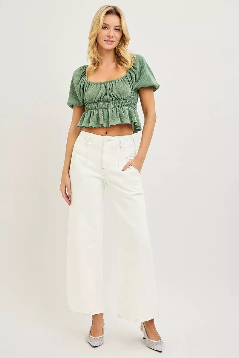 Cream RISEN high-rise ankle wide pants from Trendsi, featuring a relaxed fit and wide-leg design, shown on a model.
