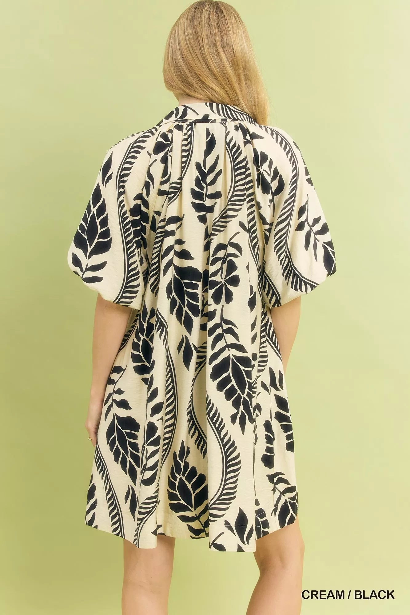 Cream and black Umgee Leafy Ogee Print Mini Dress by Trendsi, featuring a stylish pattern and a flattering fit.