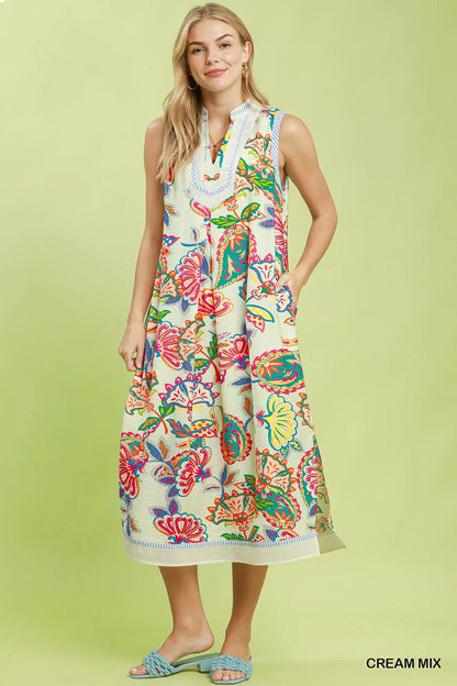 Cream paisley floral sleeveless midi dress by Umgee, featuring a relaxed fit and flowing fabric for casual or special occasions.