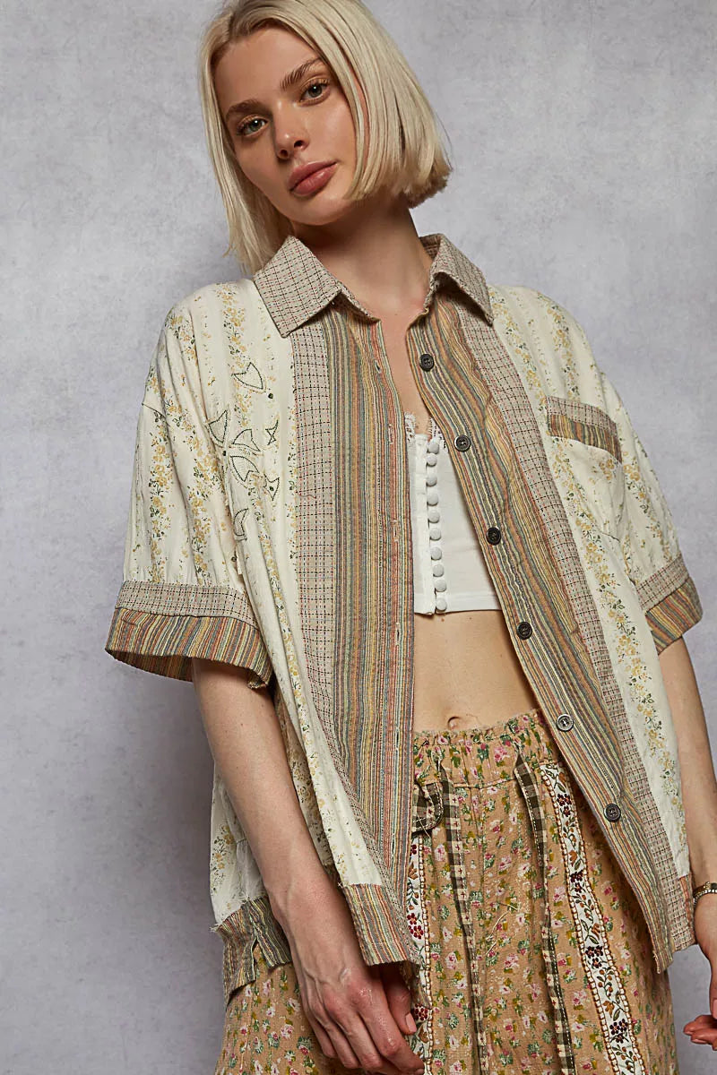 Cream multi-color printed patchwork short sleeve button-down shirt by Trendsi, featuring a casual, stylish design with patchwork details.