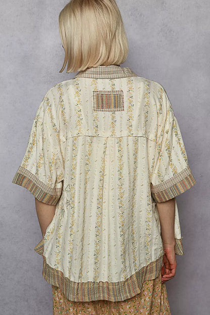 Trendi cream multi-colored printed patchwork short sleeve button-down shirt with front chest pocket, casual and stylish.