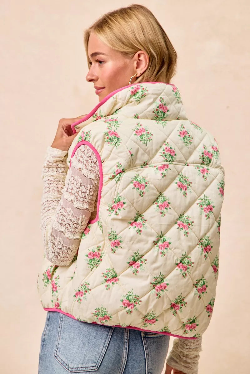 Cream and pink floral print quilted vest with piping detail from Trendsi, featuring a stylish and cozy design.